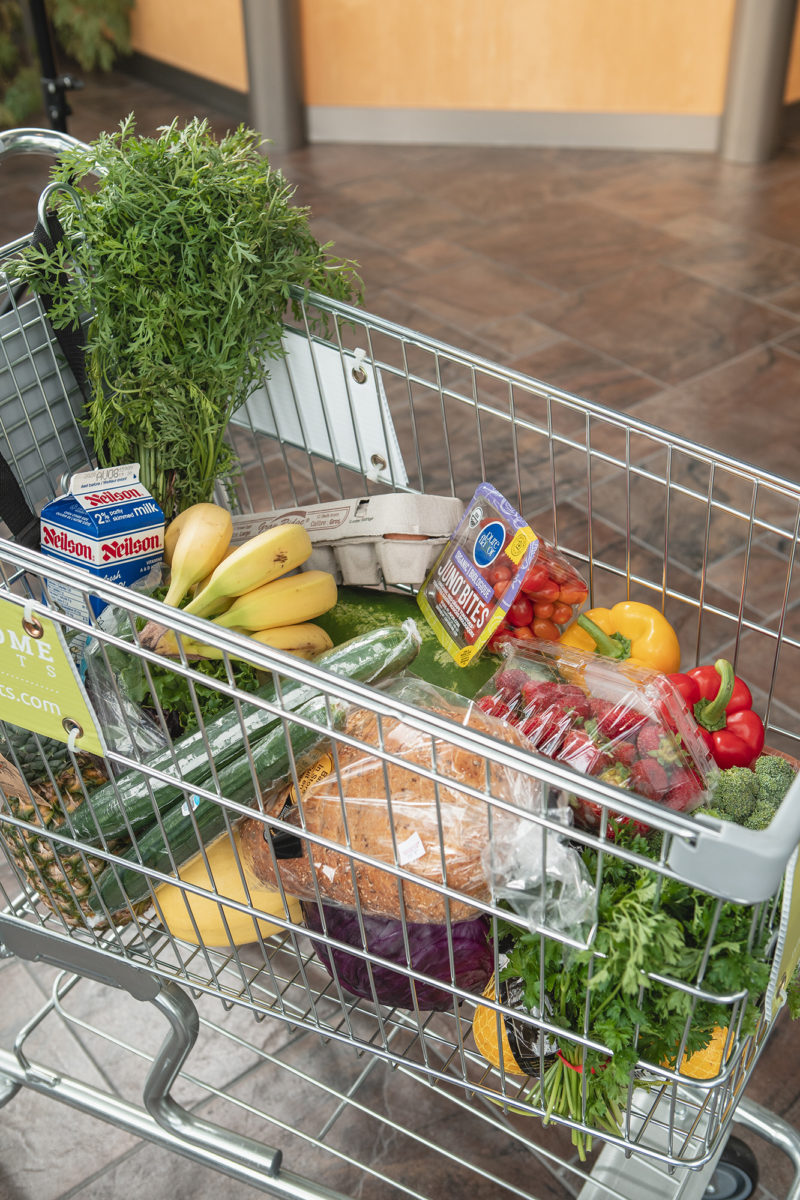 grocery cart with pack of organic juno bites red grape tomatoes