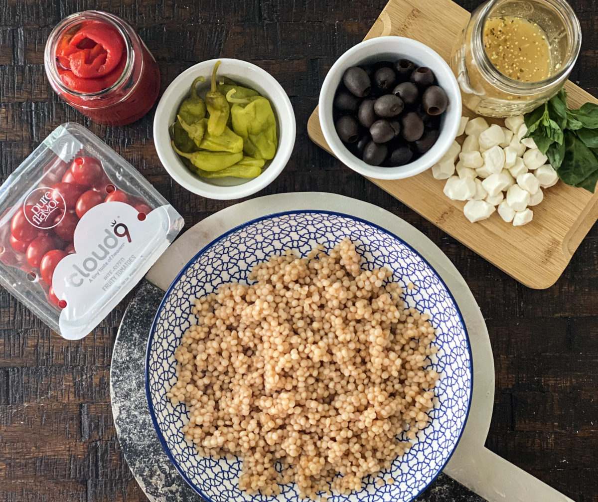 Couscous on plate, ingredients in serving plates