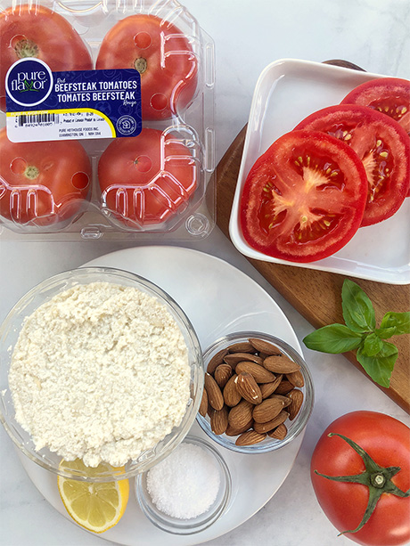 ingredients to make tomato galette including beefsteka tomatoes on countertop