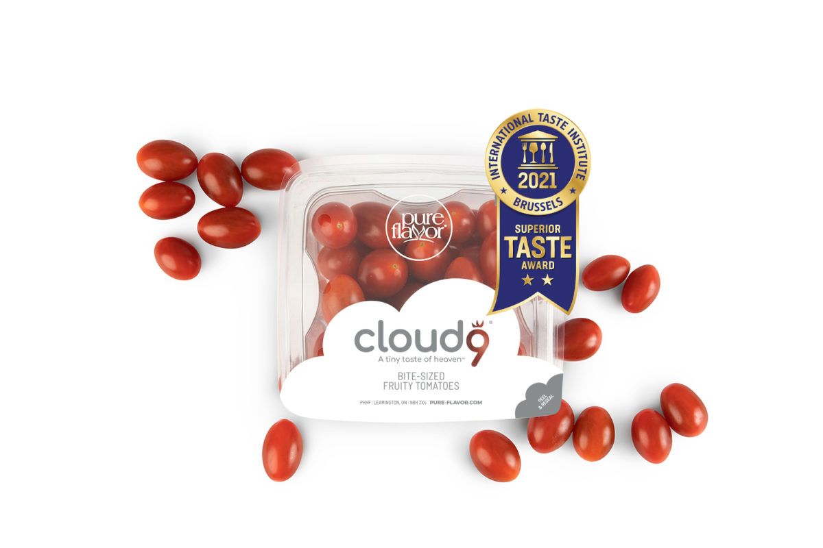 pack of cloud 9 tomatoes with loose tomatoes and a ribbon for the international taste institute's flavor award