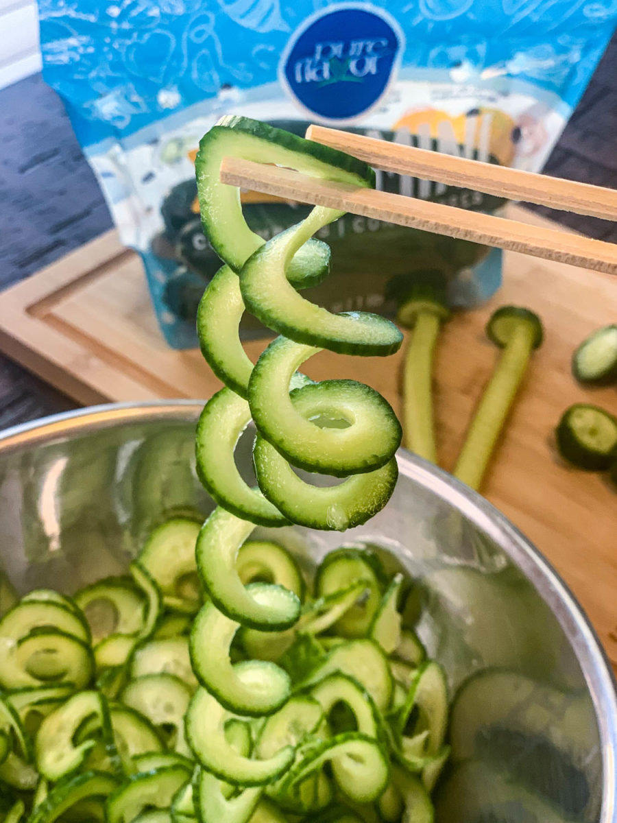 Mini cucumbers being spiralized  