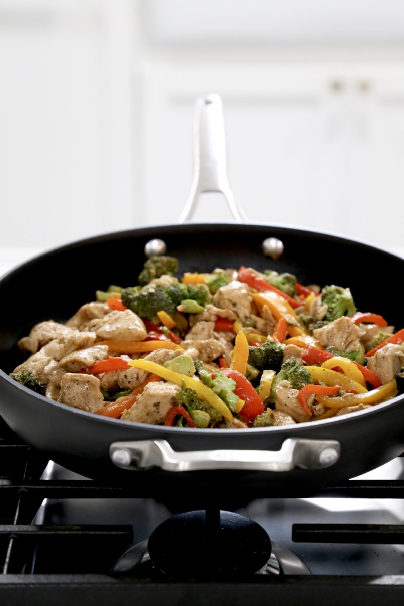 skillet filled with cooking teriyaki chicken stir fry