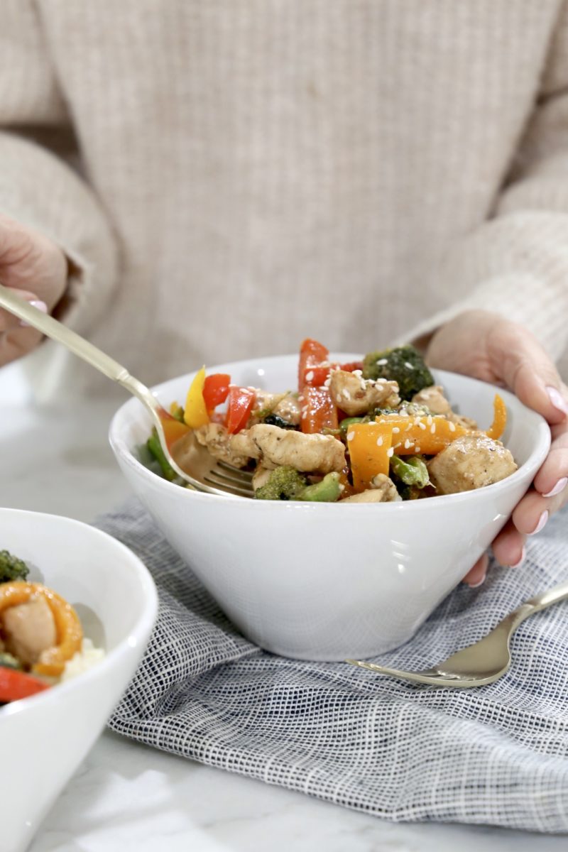 woman eating teriyaki chicken