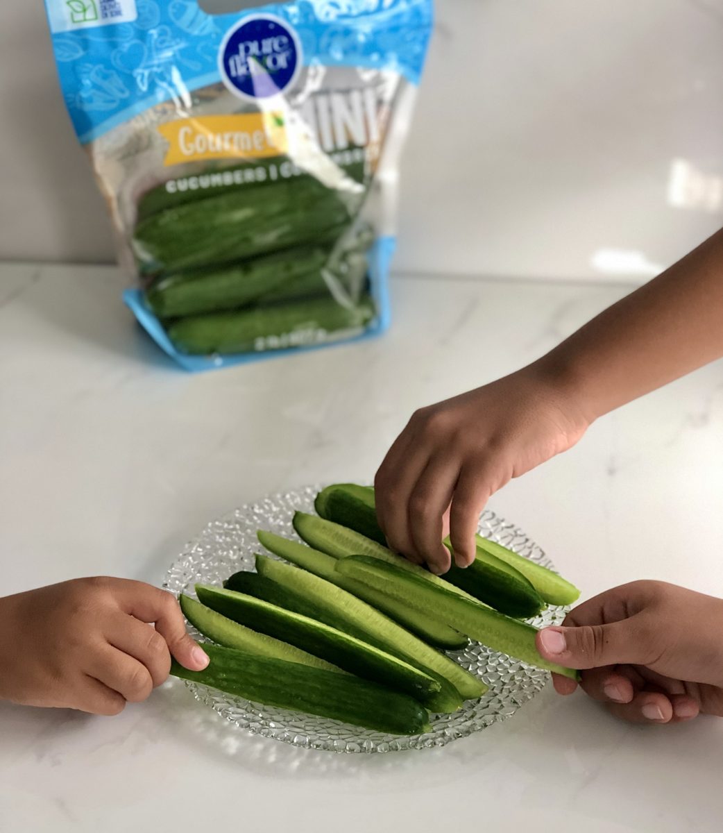 Kids Sharing Mini Cucumbers
