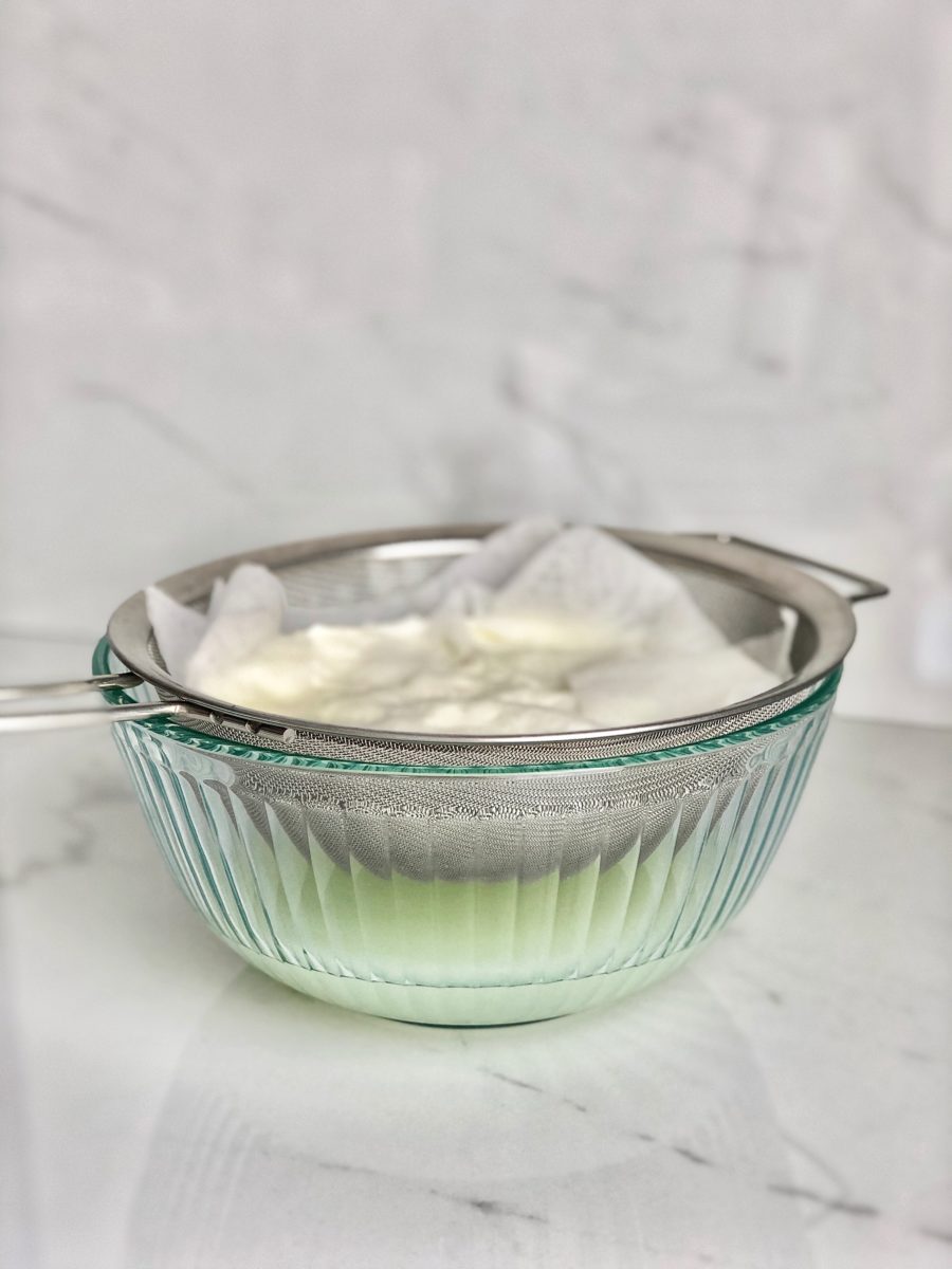 Glass bowl with labneh in kitchen