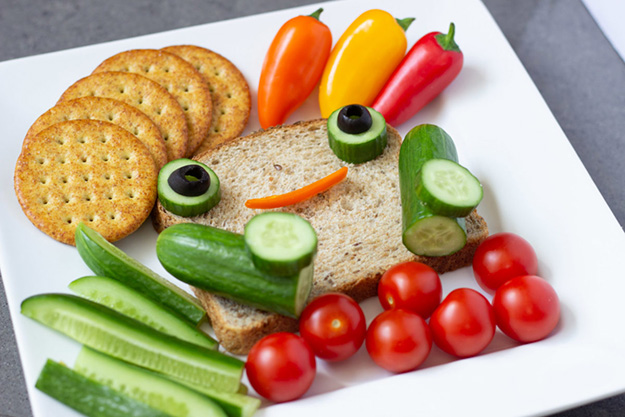 after school snacks veggies with a slice of bread and crackers