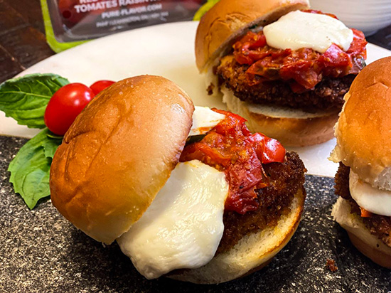 chicken parmesan and mozzarella cheese slider with tomato chutney on top