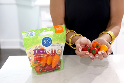 Andrea holding Aurora Bites Mini Sweet Peppers