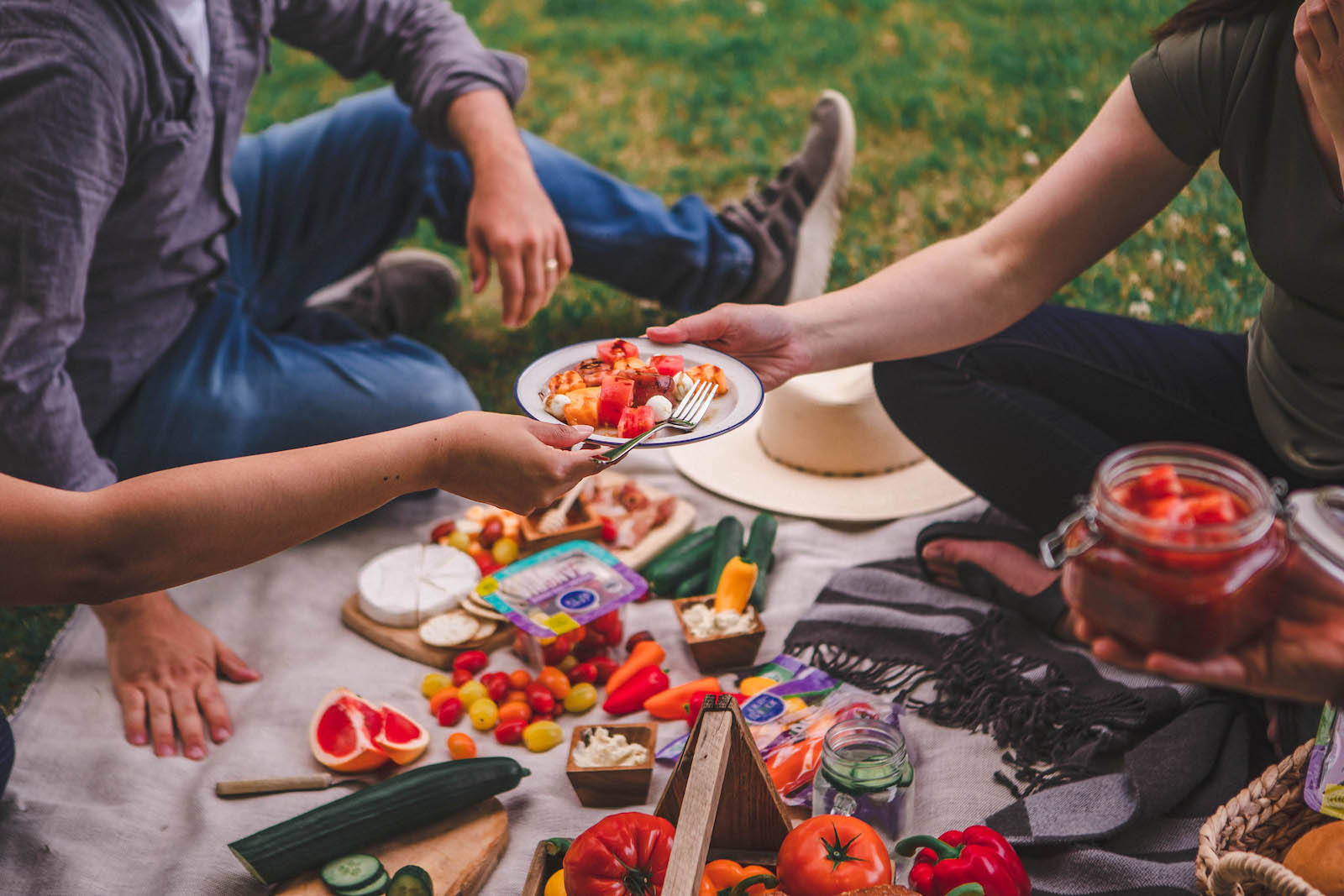 Group eating Pure Flavor® organic vegetables picnic