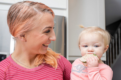 mom and baby eating a healthy snack