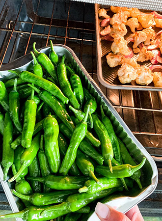 putting shishito peppers in the oven