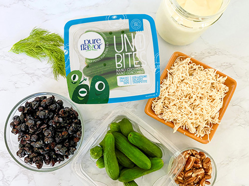 pack of Uno Bites nano cucumbers with other salad ingredients