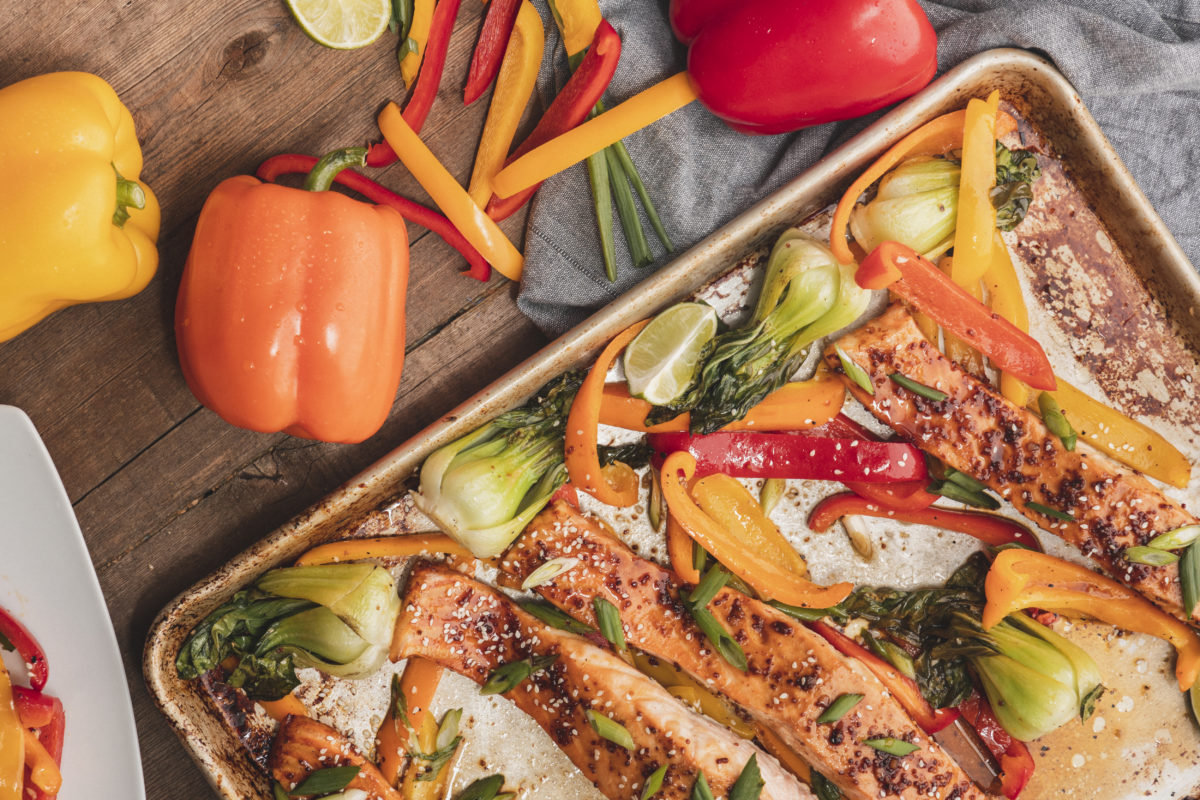 Salmon and bell peppers in baking tray