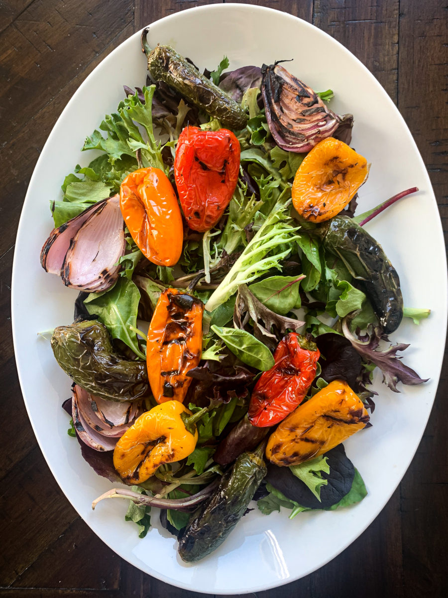 Serving plate with salad and mini peppers