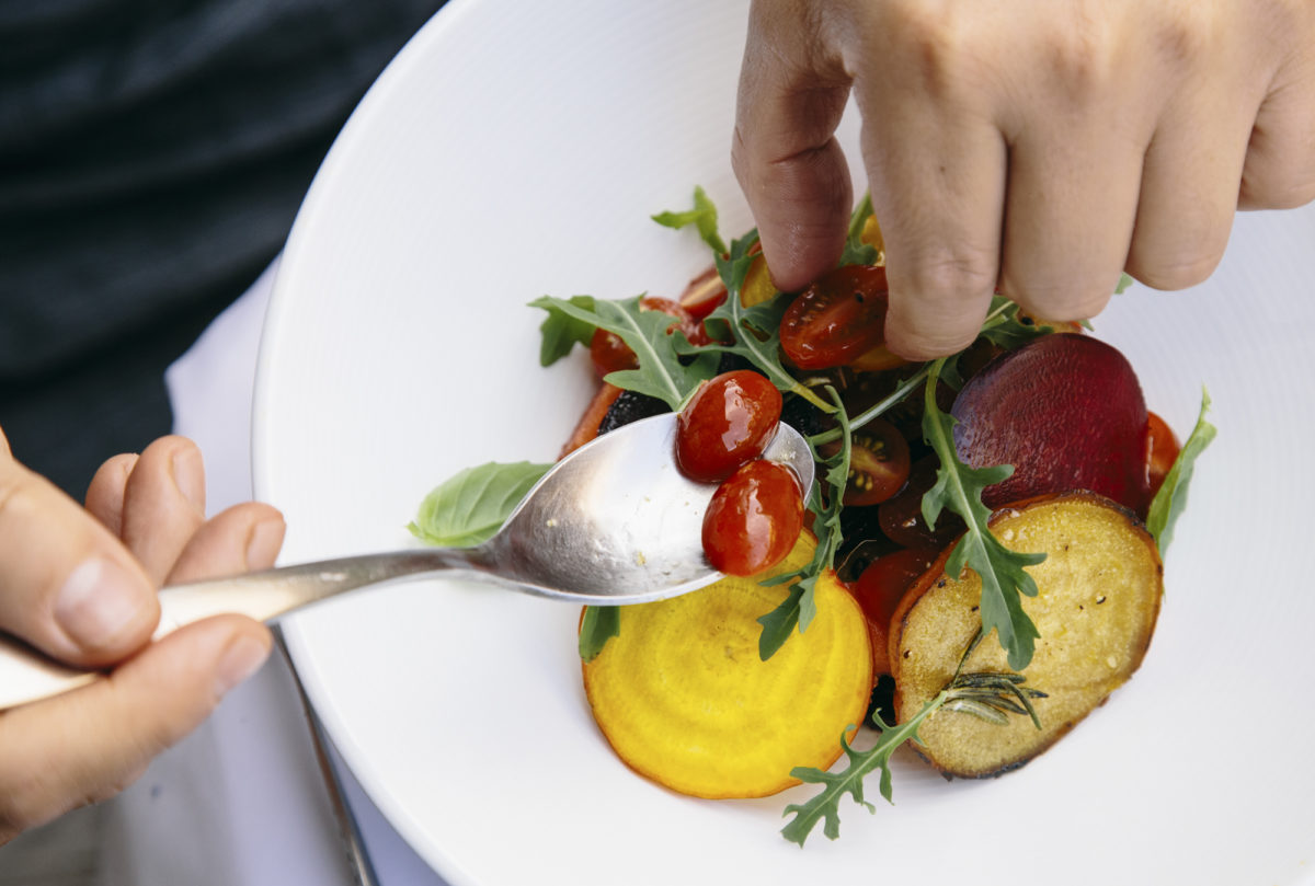 Serving tomatoes in salad bowl